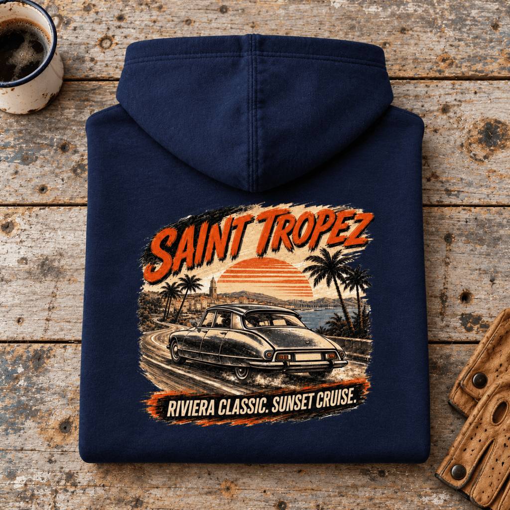 Camberline saint tropez riviera classic car navy hoodie, folded rear view on a workshop bench with the complete graphic visible.