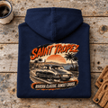 Camberline saint tropez riviera classic car navy hoodie, folded rear view on a workshop bench with the complete graphic visible.