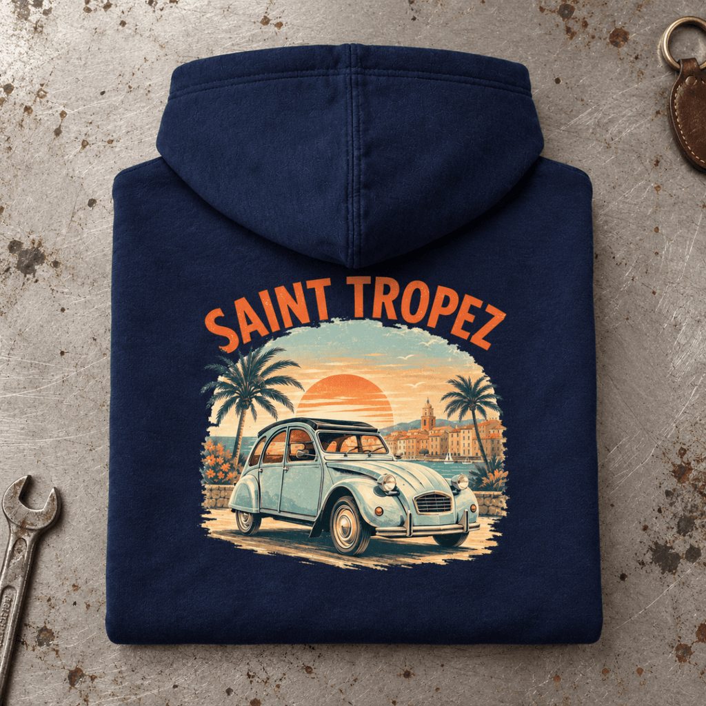 Camberline Classic French Car Graphic Hoodie in navy, folded back view on a workshop bench with the full graphic visible