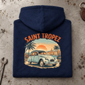 Camberline Classic French Car Graphic Hoodie in navy, folded back view on a workshop bench with the full graphic visible