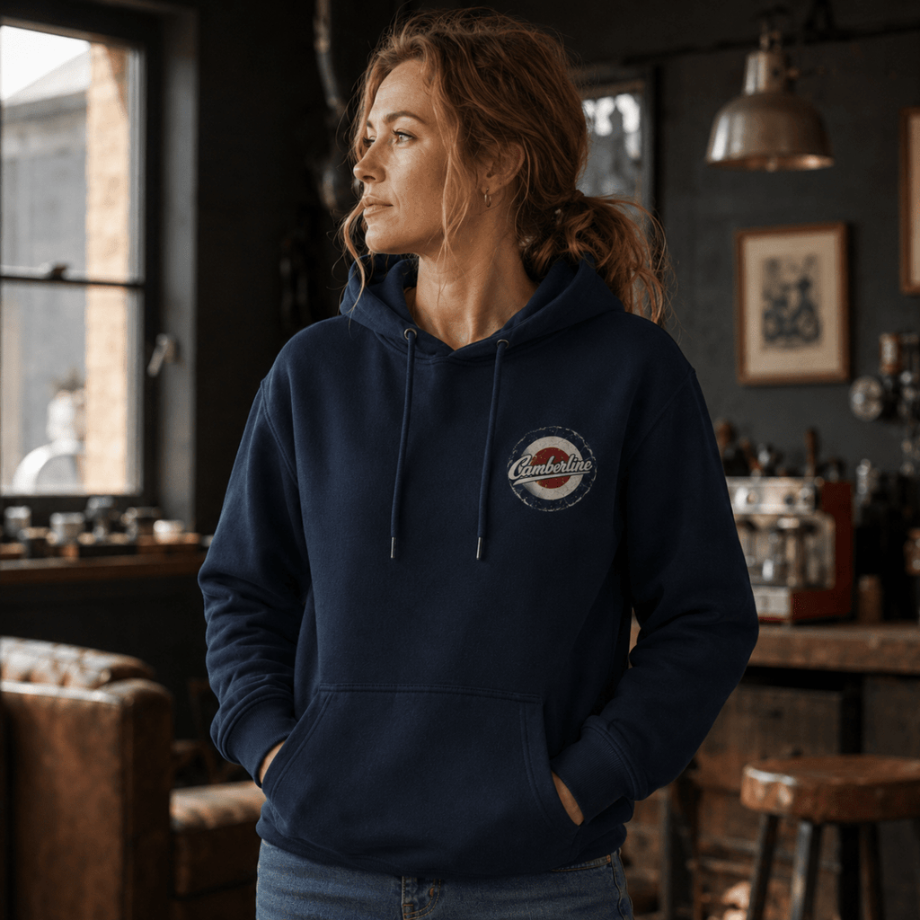 Front view of model wearing the navy Camberline hoodie with left-chest print