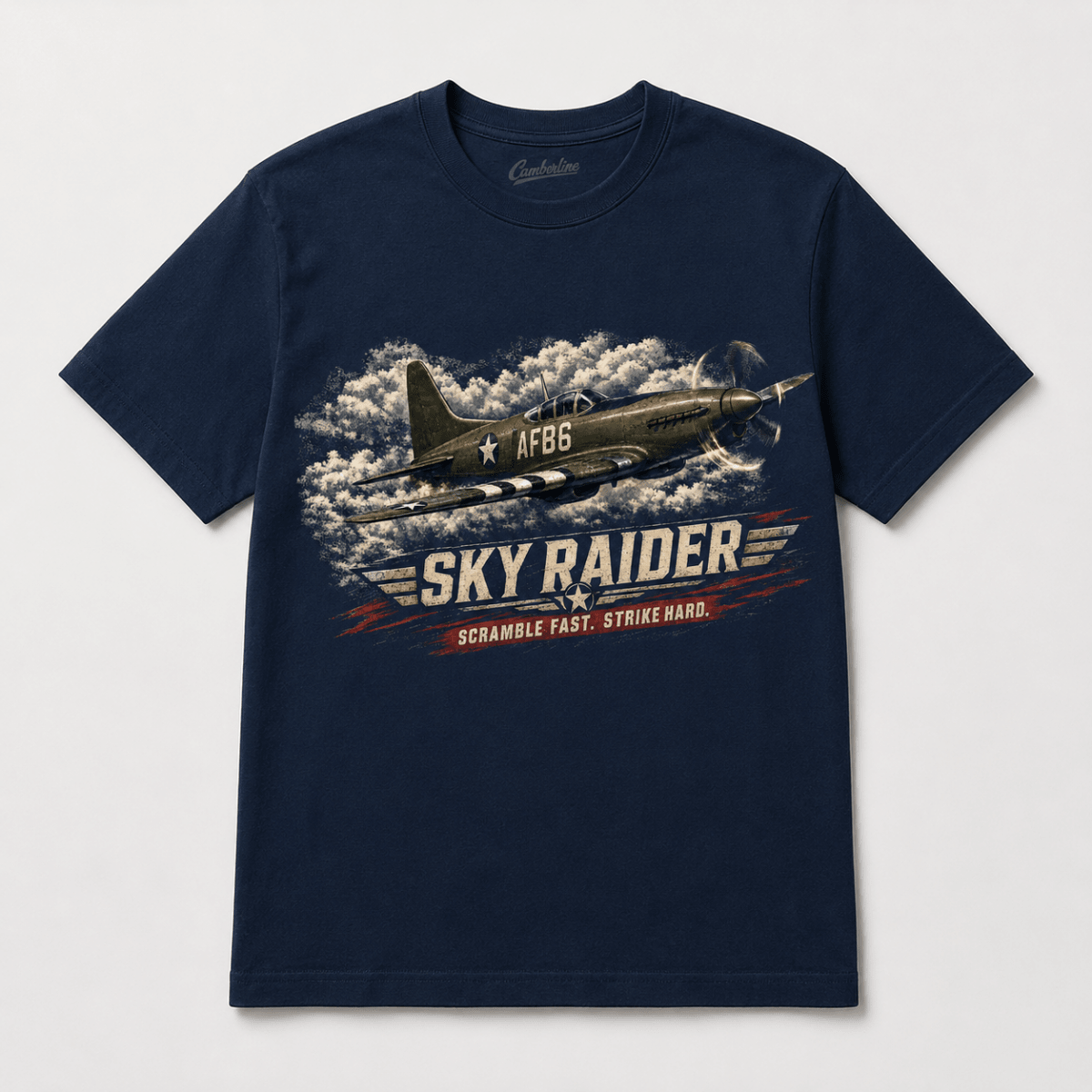 A navy blue short-sleeve crewneck t-shirt featuring a vintage military fighter plane graphic with the text 'SKY RAIDER' and 'SCRAMBLE FAST, STRIKE HARD.' on a light gray background.