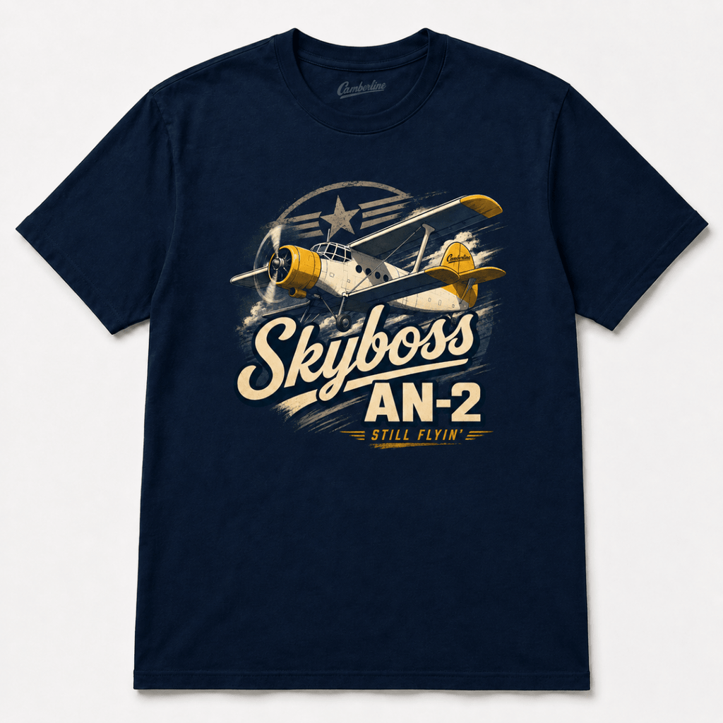 A navy blue short-sleeve t-shirt with a vintage-style graphic of a biplane and the text 'Skyboss AN-2 STILL FLYIN'' printed on the front, displayed against a light gray background.