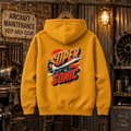 Mustard Super Sonic Concorde graphic hoodie hanging in a gritty vintage aviation workshop
