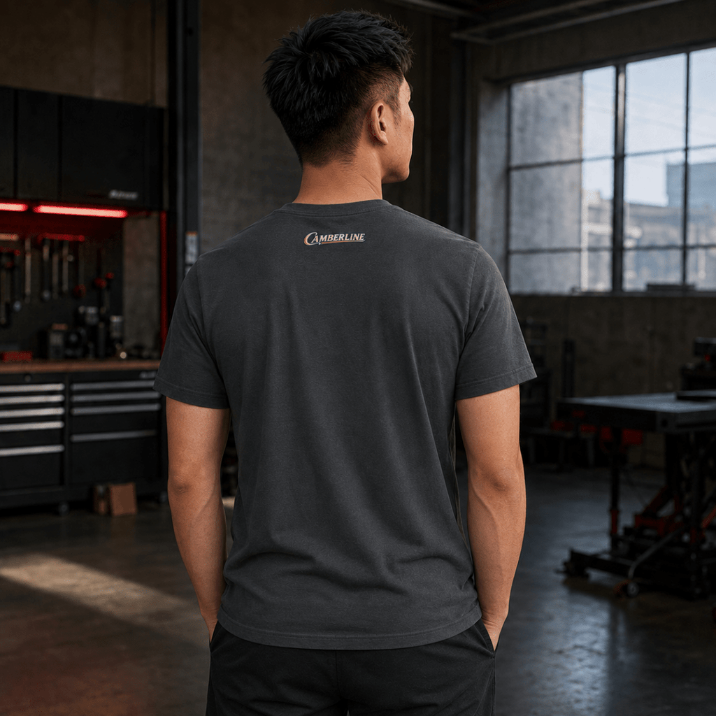 Back view of model wearing the dark grey Camberline T-shirt with nape print