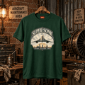 Forest green Supersonic London New York Paris Concorde graphic T-shirt in a gritty aviation workshop