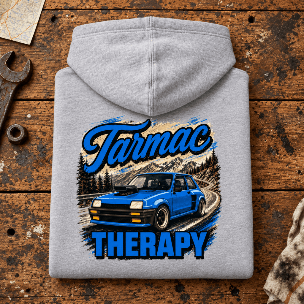 Hot Hatch Graphic Hoodie – Tarmac Therapy Widebody Performance, folded back main hero on a worn automotive workbench – car-hd-0012