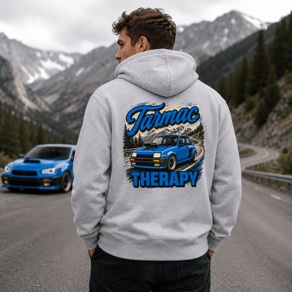 Model wearing the Camberline Cars Tarmac Therapy Widebody Hatch Hoodie – Heather Grey, showing the automotive graphic in a car culture setting