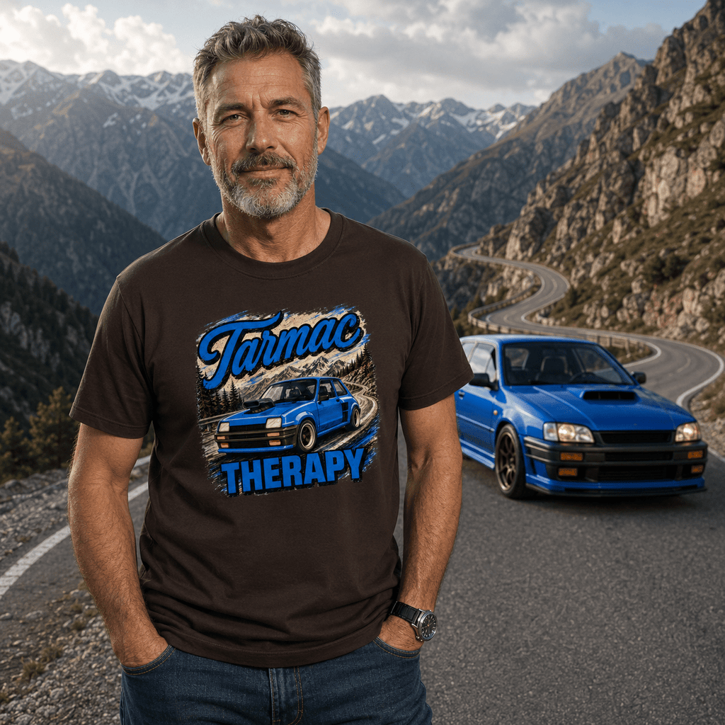 Model wearing the Camberline Cars Tarmac Therapy Widebody Hatch T-Shirt – Dark Chocolate, showing the automotive graphic in a car culture setting
