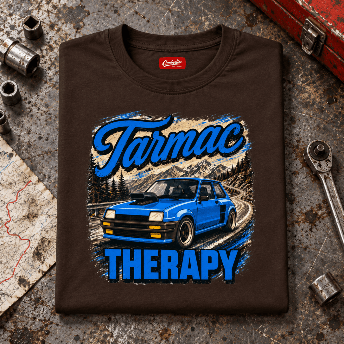 Hot Hatch Graphic T-Shirt – Tarmac Therapy Widebody Performance, folded front hero on a worn automotive workbench – car-ts-0012