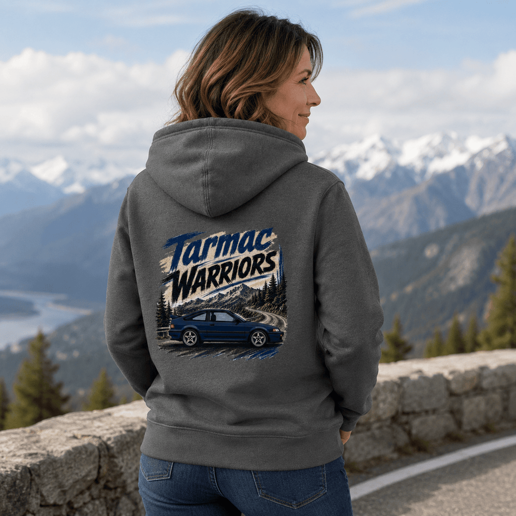 Model wearing the Camberline Cars Tarmac Warriors Retro Coupe Hoodie – Storm Grey, showing the automotive graphic in a car culture setting