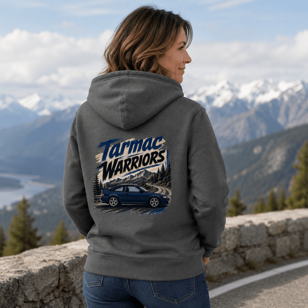 Model wearing the Camberline Cars Tarmac Warriors Retro Coupe Hoodie – Storm Grey, showing the automotive graphic in a car culture setting