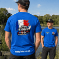 Two men wearing bright blue t-shirts outdoors by a lake. The man in the foreground shows the back of the shirt with a large 'Teddy Fisher' graphic in red, white, and blue, social media icons, and 'teddyfisher.
