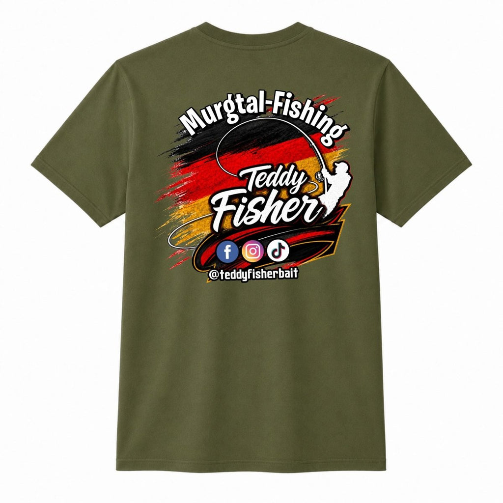 An olive green short-sleeve t-shirt with a large graphic on the front. The graphic features the text 'Murgtal-Fishing' and 'Teddy Fisher' in white stylized lettering over a red, black, and yellow paint-splatter design, with social media icons and '@teddyfisherbaft' below.