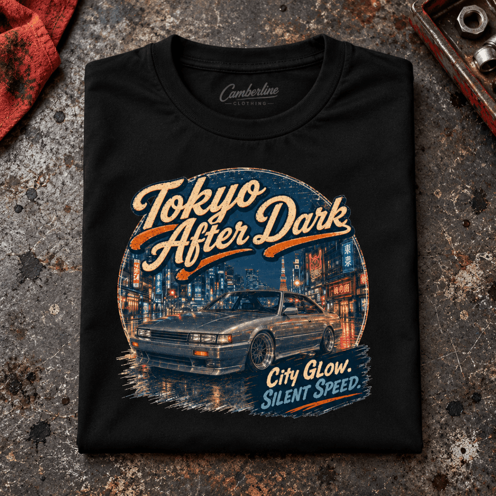 Classic Coupe Graphic T-Shirt – Tokyo After Dark Drift JDM Night Culture, folded front main hero on a worn automotive workbench – car-ts-0065