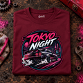 JDM Car Graphic T-Shirt – Tokyo Night Sports Car, folded front main hero on a worn automotive workbench – car-ts-0034