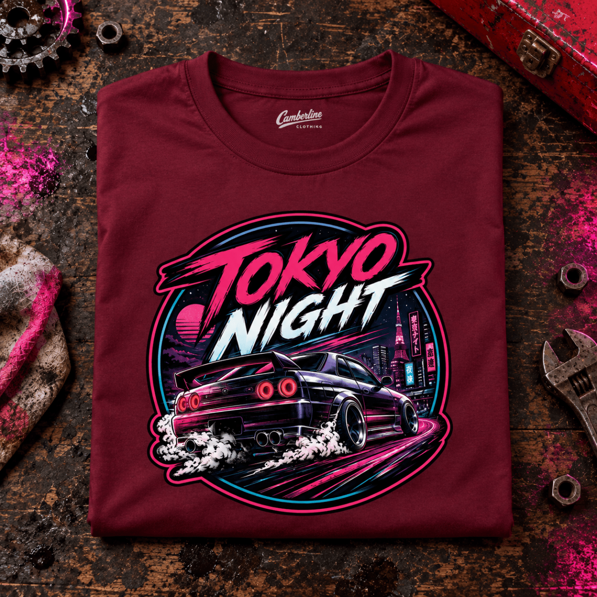 JDM Car Graphic T-Shirt – Tokyo Night Sports Car, folded front main hero on a worn automotive workbench – car-ts-0034