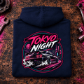 JDM Car Graphic Hoodie – Tokyo Night Drift Car, folded back main hero on a worn automotive workbench – car-hd-0034