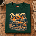 Folded forest green Trailside Tales Adventure T-shirt front on a workshop bench — car-ts-0006