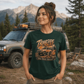 Model wearing Camberline Cars Trailside Tales T-Shirt in Forest Green