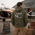 Combat green hoodie showing a classic tri-motor transport aircraft with "Tri-Motor The Legendary Workhorse" text.