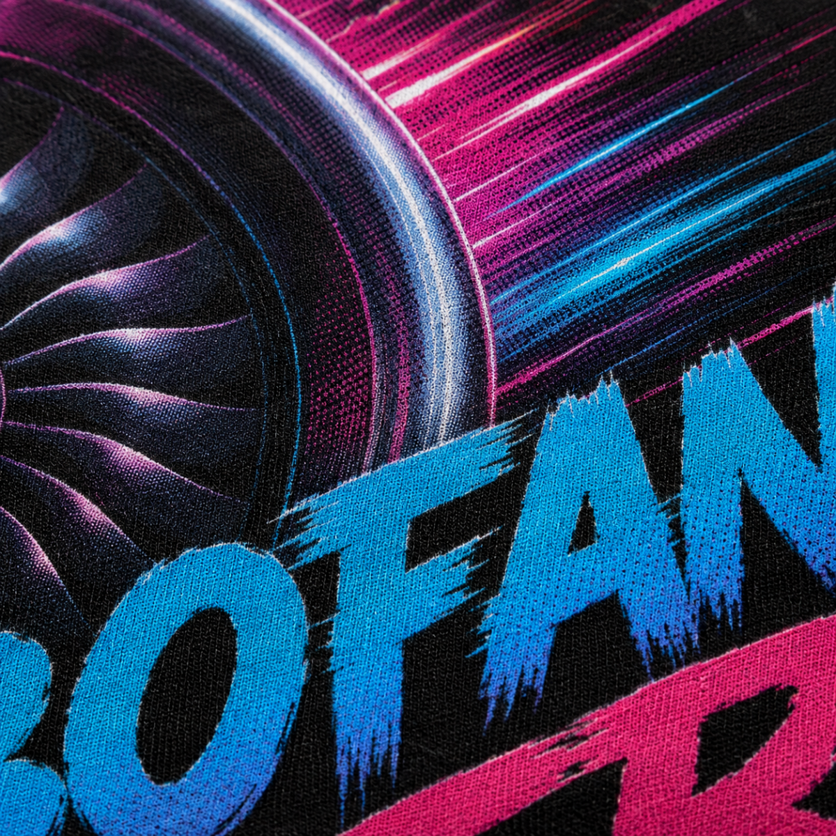 Close-up of a graphic textile print featuring a stylized turbocharger fan in dark metallic tones, neon magenta and blue streaks, and large blue and pink lettering on a black background.