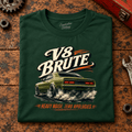 V8 Brute Muscle Car Raw Power Graphic T-Shirt — Forest Green, folded front main hero on a worn automotive workbench – car-ts-0072