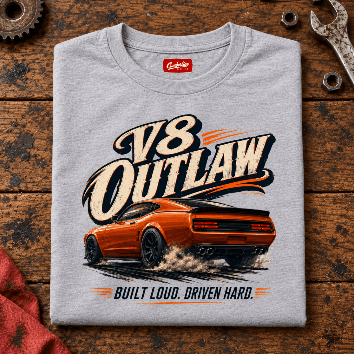 Folded sport grey V8 Outlaw American Iron T-shirt front on a workshop bench — car-ts-0087