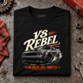 V8 Rebel Muscle Car Counter Culture Graphic T-Shirt — Black, folded front main hero on a worn automotive workbench – car-ts-0076