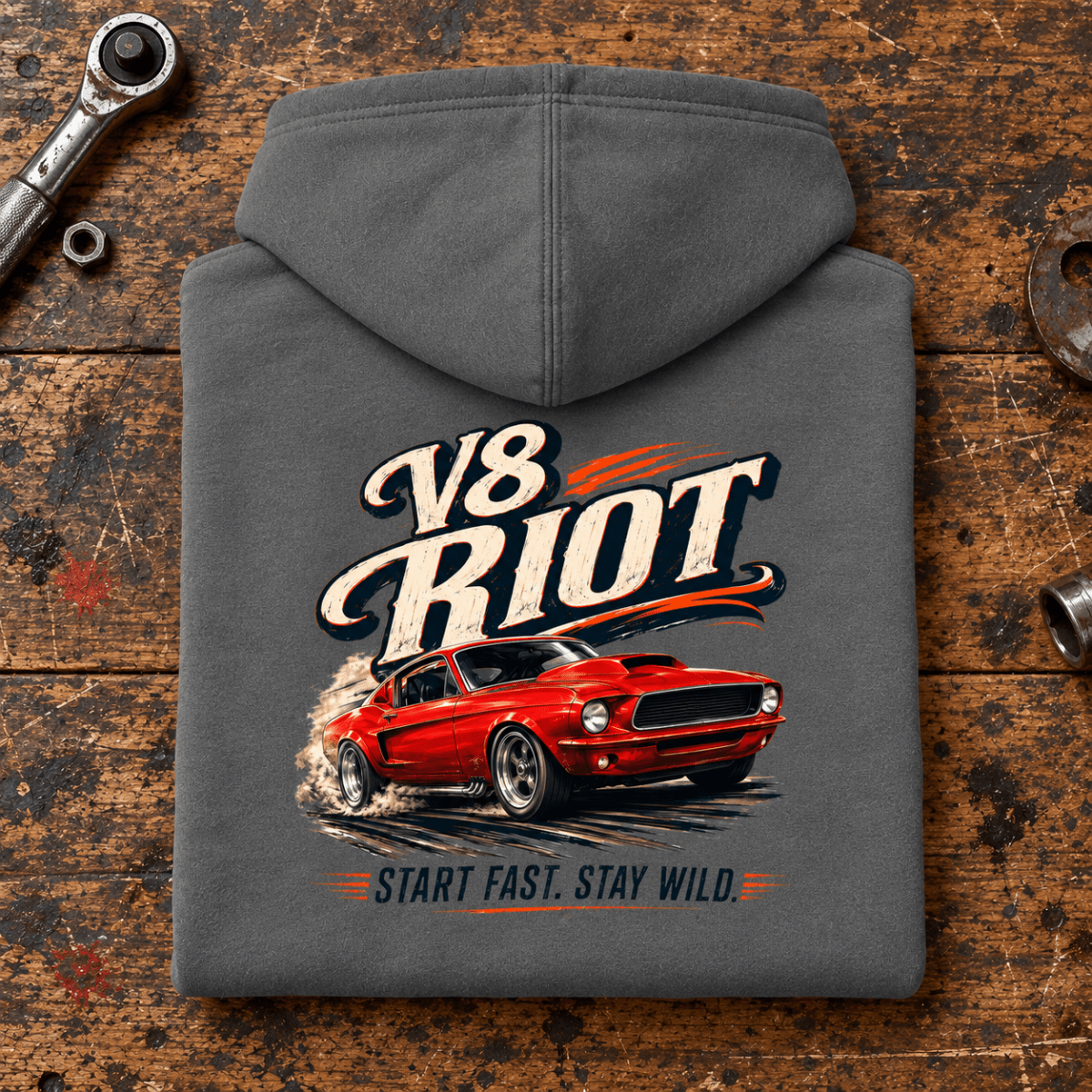 Muscle Car Graphic Hoodie – V8 Riot Classic Car Burnout, folded back main hero on a worn automotive workbench – car-hd-0028