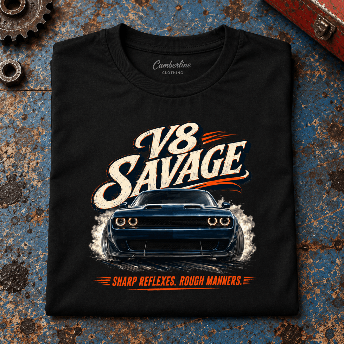 Muscle Car Graphic T-Shirt – V8 Savage Raw Power, folded front main hero on a worn automotive workbench – car-ts-0066