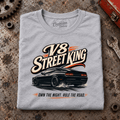 Muscle Car Graphic T-Shirt – V8 Street King American Iron, folded front main hero on a worn automotive workbench – car-ts-0063