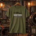 Military green Warthog Firepower attack aircraft graphic T-shirt in a gritty aviation workshop