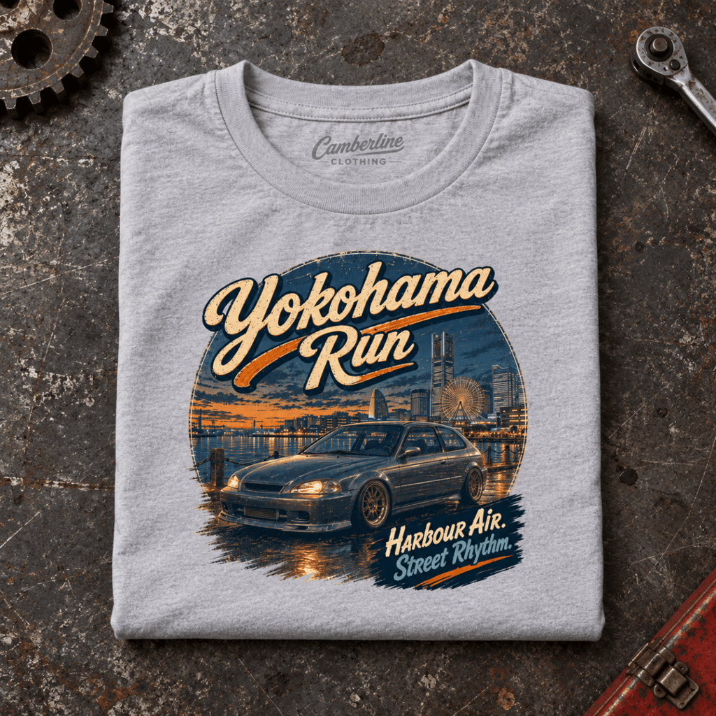 Hot Hatch Graphic T-Shirt – Yokohama Run JDM, folded front main hero on a worn automotive workbench – car-ts-0062