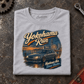 Hot Hatch Graphic T-Shirt – Yokohama Run JDM, folded front main hero on a worn automotive workbench – car-ts-0062